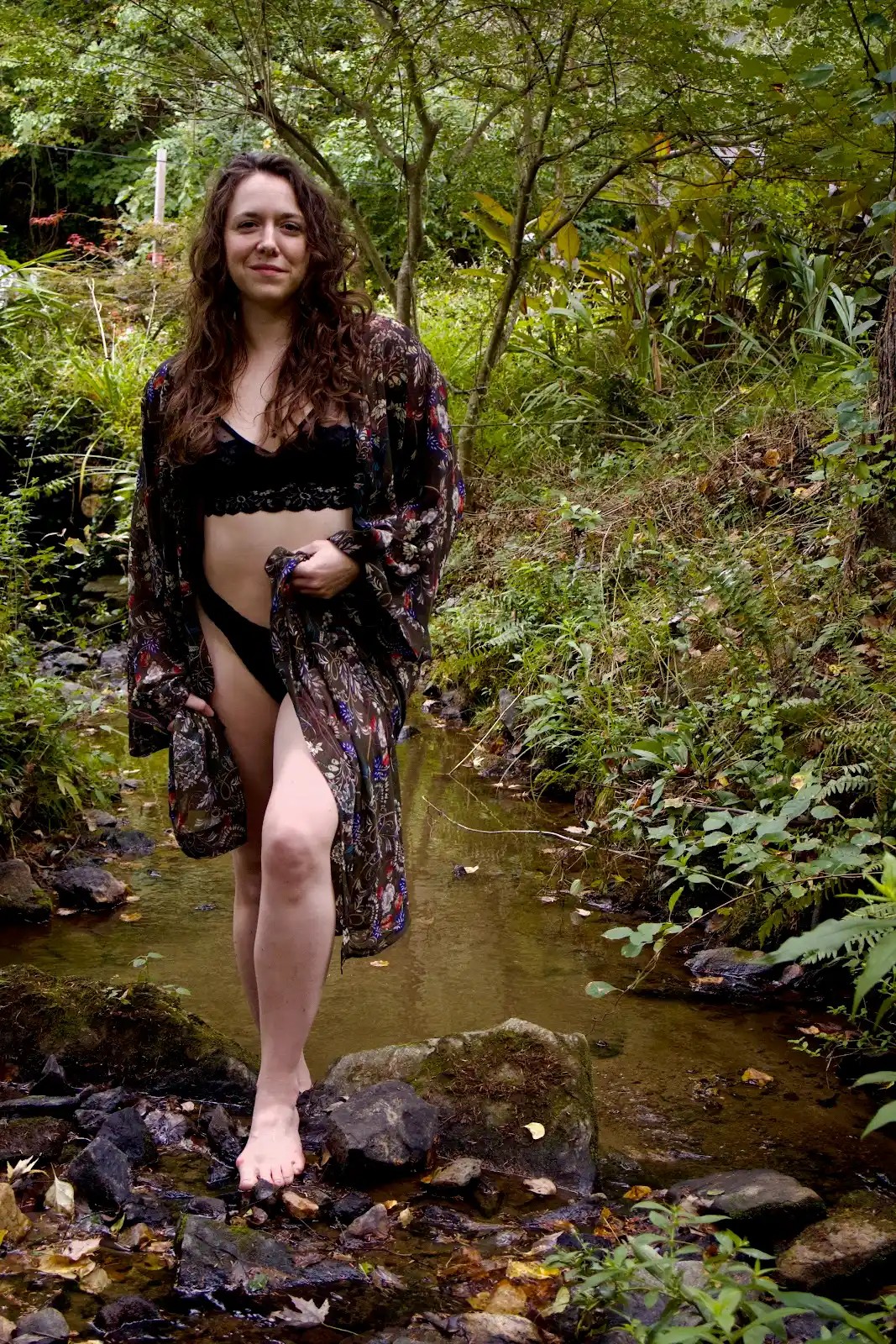 Honey standing beside a woodland stream